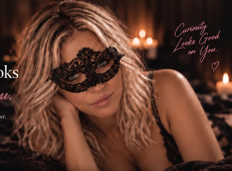 Masked blonde Lacey in a candlelit setting
